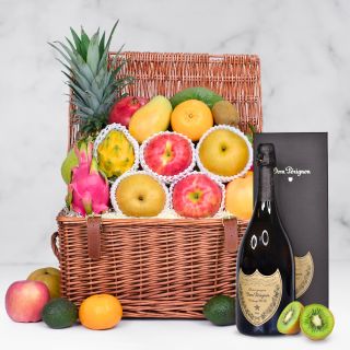 Basket of fresh seasonal fruits and bottle of Dom Perignon Champagne
